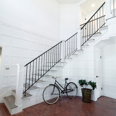 Entryway - mid-sized farmhouse brick floor and red floor entryway idea in Salt Lake City with white walls