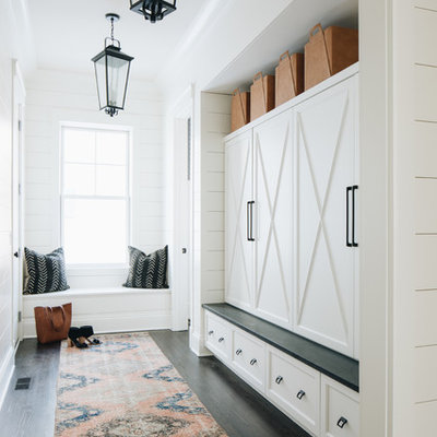 Farmhouse dark wood floor and brown floor mudroom photo in Chicago with white walls