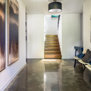 Modern Foyer with Cement Floors