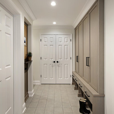 Inspiration for a large transitional porcelain tile and beige floor mudroom remodel in Chicago with white walls