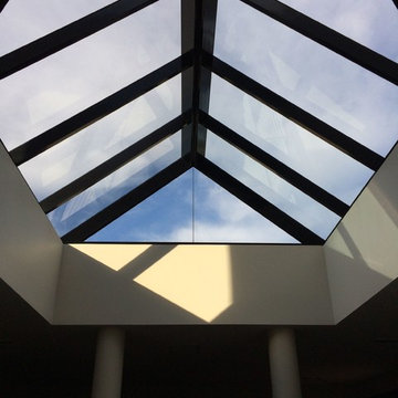 Modern interior glass roof bringing light and space to the home