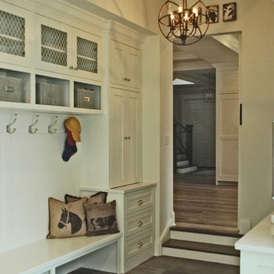 Large farmhouse slate floor mudroom photo in Chicago with white walls