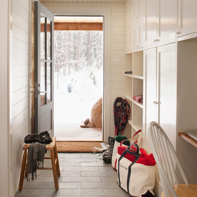 Example of a classic slate floor and gray floor mudroom design in Boston