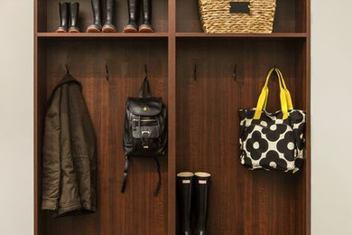 Inspiration for a small timeless carpeted mudroom remodel in New York with beige walls