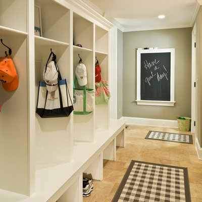 Large elegant travertine floor and brown floor mudroom photo in DC Metro with green walls