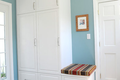 Mudroom - small transitional slate floor mudroom idea in Baltimore with blue walls