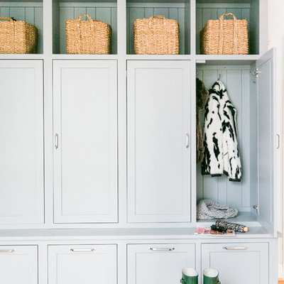 Mudroom - large cottage light wood floor mudroom idea in Baltimore with gray walls and a black front door