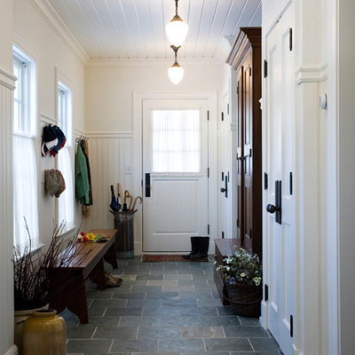 Elegant slate floor and gray floor mudroom photo in Boston