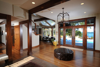 Example of an arts and crafts entryway design in Other with a medium wood front door