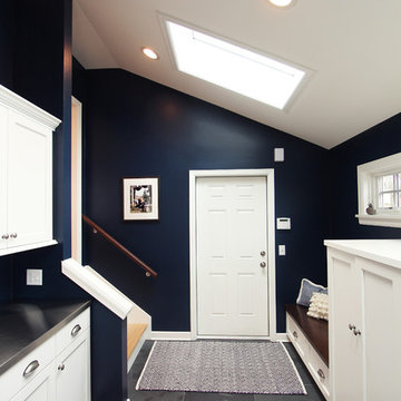 Navy Blue Mudroom off Kitchen with Coat Closets and Bench