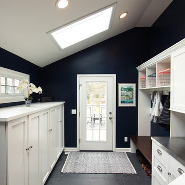 Navy Blue Mudroom with White Built In Cabinets with Coat Storage