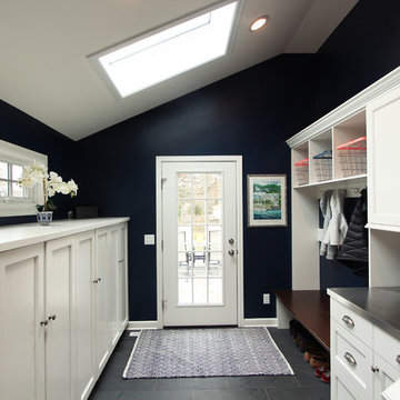 Navy Blue Mudroom with White Built In Cabinets with Coat Storage