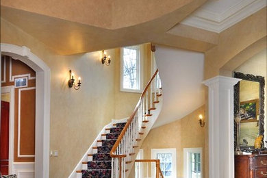 Inspiration for a huge timeless limestone floor foyer remodel in Chicago with beige walls