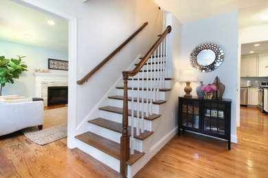 Inspiration for a transitional medium tone wood floor entryway remodel in Portland Maine with blue walls