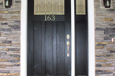 Single front door photo in Boston with a black front door