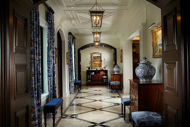 Example of a large classic marble floor double front door design in Miami with white walls and a dark wood front door