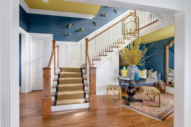 Inspiration for a large bohemian foyer in Nashville with blue walls and medium hardwood flooring.