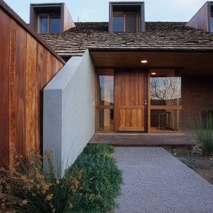 Entryway - contemporary entryway idea in Phoenix with a medium wood front door
