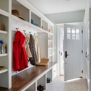 Esempio di un grande ingresso con anticamera classico con pareti blu, pavimento con piastrelle in ceramica, una porta singola e una porta bianca