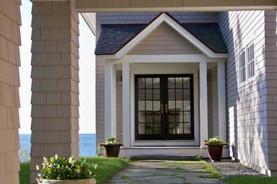 Inspiration for a mid-sized timeless double front door remodel in Portland Maine with beige walls and a glass front door