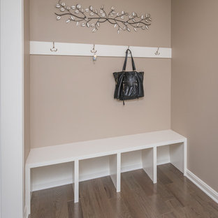 Mudroom - small transitional dark wood floor and brown floor mudroom idea in Louisville with beige walls