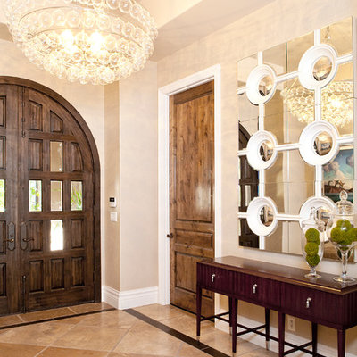 Entryway - mid-sized contemporary marble floor and brown floor entryway idea in Las Vegas with a dark wood front door