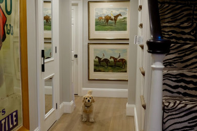 Entryway - mid-sized transitional light wood floor and beige floor entryway idea in Boston with white walls