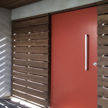 orange pivot gate at courtyard entry