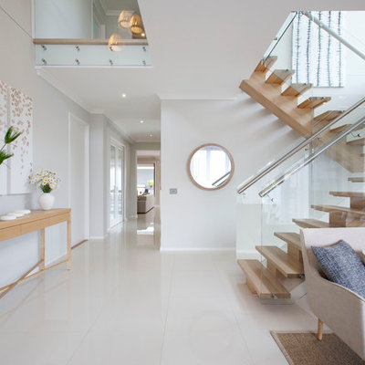Example of a trendy foyer design in Melbourne with white walls