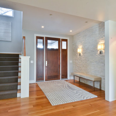 Entryway - contemporary entryway idea in Minneapolis with gray walls and a dark wood front door