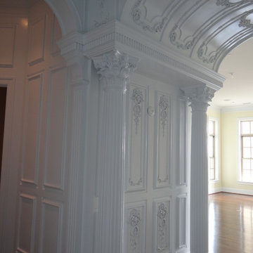 Ornate paneling including foyer barrell plus fluted columns