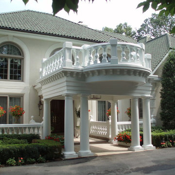 Ornate porte cochere added to a large house that was missing a covered entry