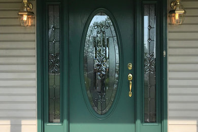Example of a small classic entryway design in Columbus with beige walls and a green front door