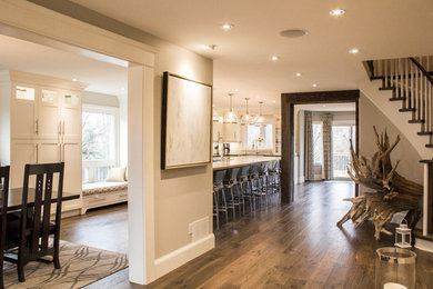 Medium tone wood floor entryway photo in Toronto with beige walls