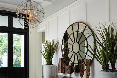 Example of a transitional beige floor foyer design in Miami with gray walls