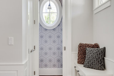 Small transitional medium tone wood floor entry hall photo in San Francisco with gray walls