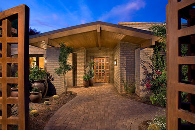 Entryway - mid-sized craftsman entryway idea in Phoenix with a light wood front door and beige walls