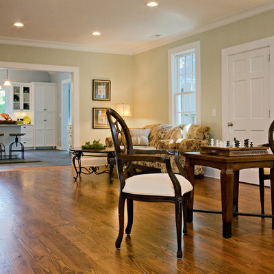 Entryway - mid-sized country medium tone wood floor and brown floor entryway idea in Raleigh with green walls and a white front door