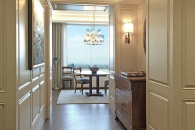 Foyer - mid-sized transitional medium tone wood floor foyer idea in New York with beige walls