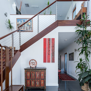 Design ideas for an asian entryway in Adelaide with white walls and grey floor.