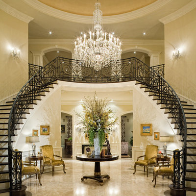 Inspiration for a huge timeless marble floor foyer remodel in Los Angeles with beige walls