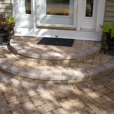 Entryway - mid-sized brick floor entryway idea in Minneapolis with a white front door