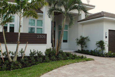 Example of a large entryway design in Miami with a brown front door