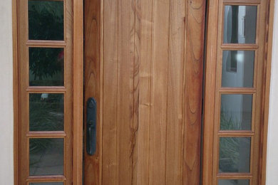 Entryway - entryway idea in San Diego with a medium wood front door