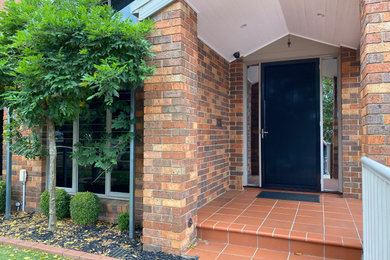 Single front door - modern single front door idea in Melbourne with a black front door