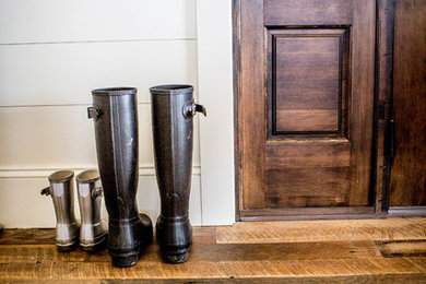 Inspiration for a rustic mudroom remodel in Other