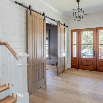 Reverse View of Entry with Barn Doors Opening to Home Office