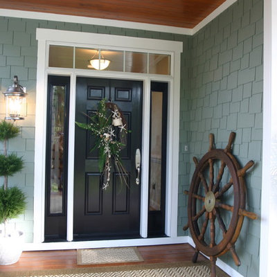 Elegant entryway photo in Raleigh with a black front door