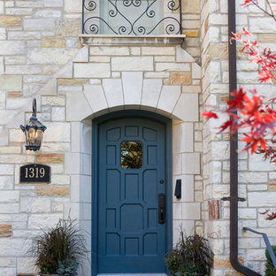 Inspiration for a large timeless gray floor entryway remodel in Chicago with beige walls and a blue front door
