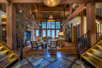 Photo of a rustic entrance in Other with white walls and medium hardwood flooring.